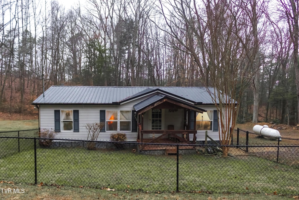 view of front of property with a porch and a front lawn