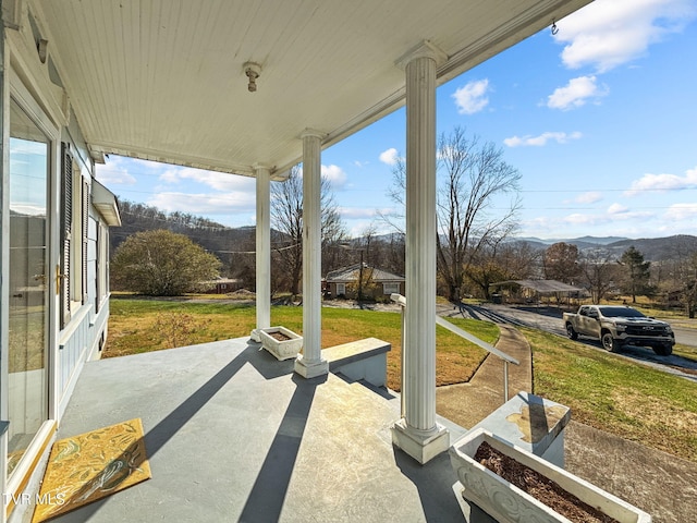 view of patio / terrace featuring a mountain view