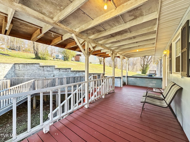 wooden deck with a yard