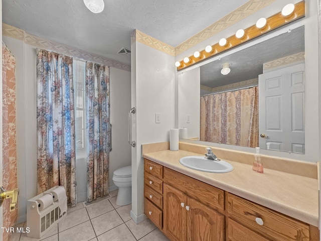 full bath featuring toilet, tile patterned floors, a textured ceiling, and vanity