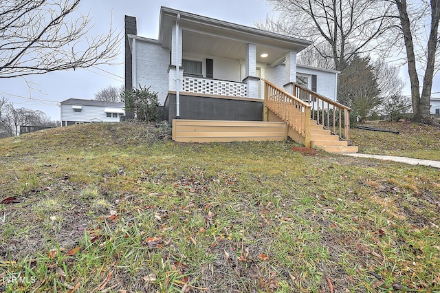 view of home's exterior with a lawn