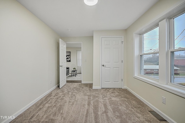 unfurnished bedroom with light carpet