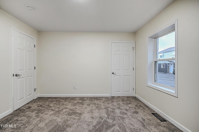 view of carpeted spare room