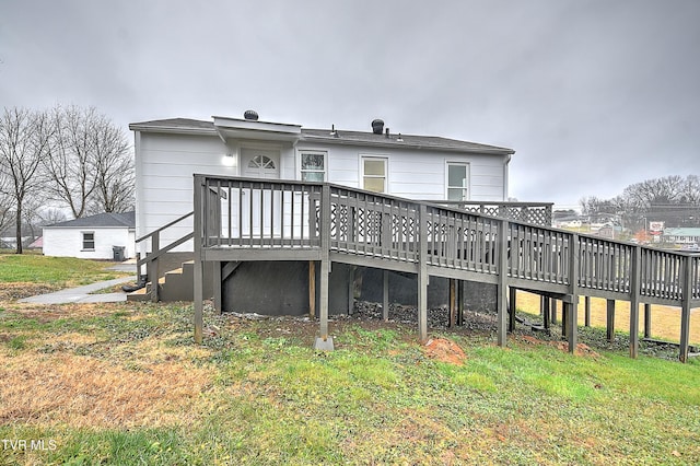 back of property featuring a deck