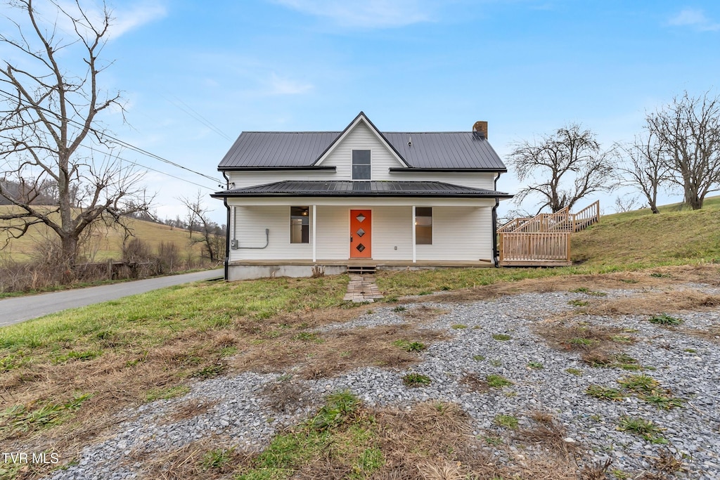 view of front of property featuring covered porch