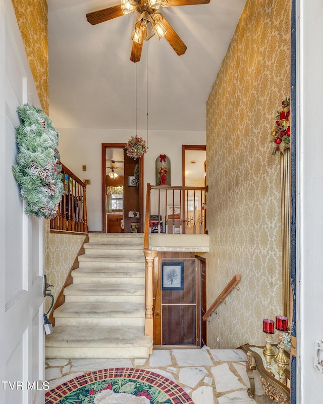 stairway with ceiling fan