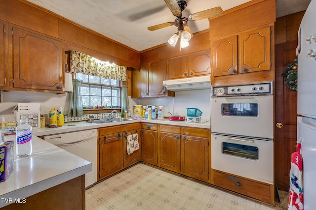 kitchen featuring ceiling fan, white appliances, and sink