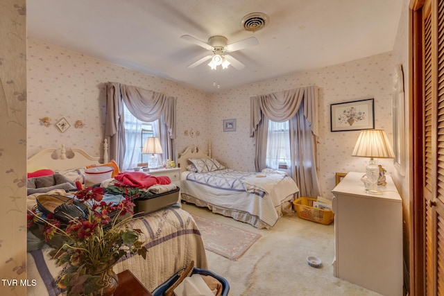 carpeted bedroom featuring ceiling fan