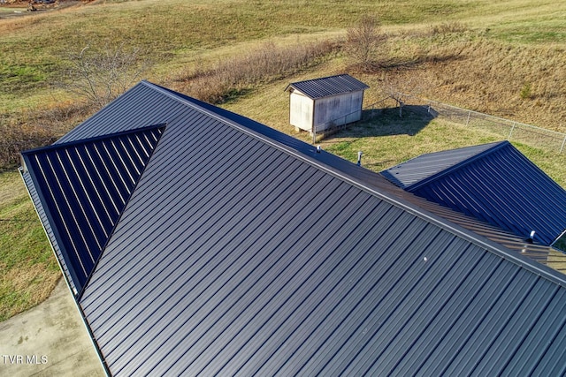 exterior space featuring a lawn and a shed