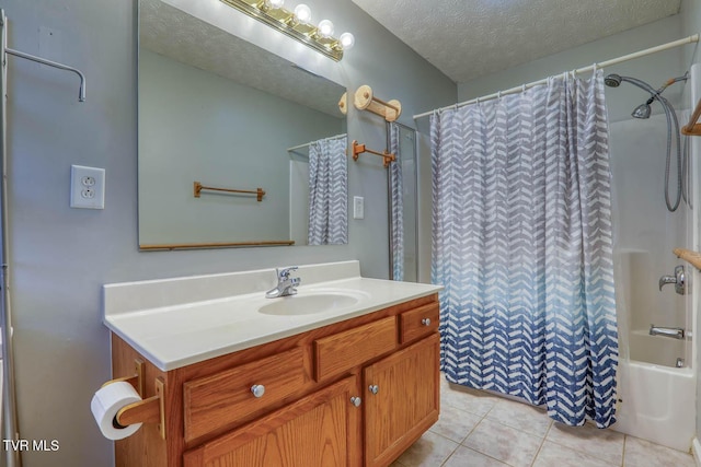 bathroom with tile patterned floors, vanity, shower / bathtub combination with curtain, and a textured ceiling