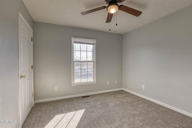 carpeted empty room with ceiling fan