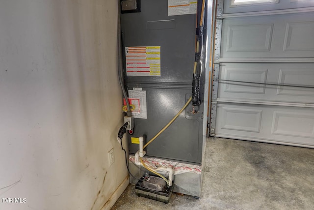 utility room featuring heating unit