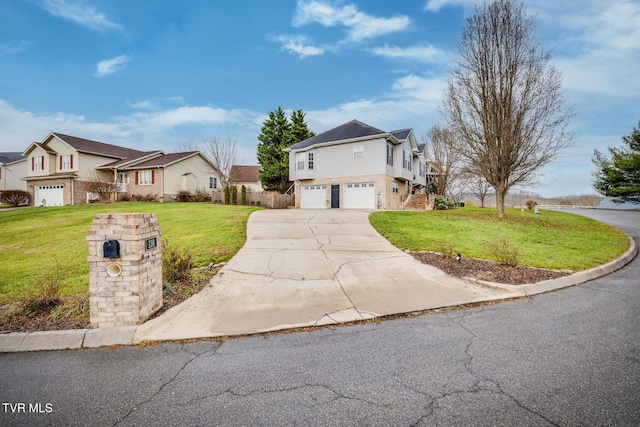 view of property featuring a garage and a front lawn