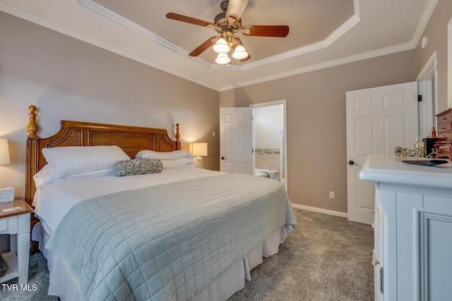 carpeted bedroom featuring a tray ceiling, ceiling fan, and crown molding