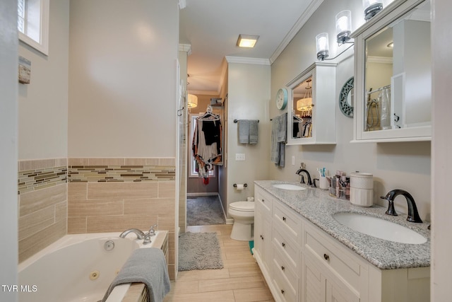 bathroom featuring vanity, crown molding, tile walls, toilet, and a bathing tub