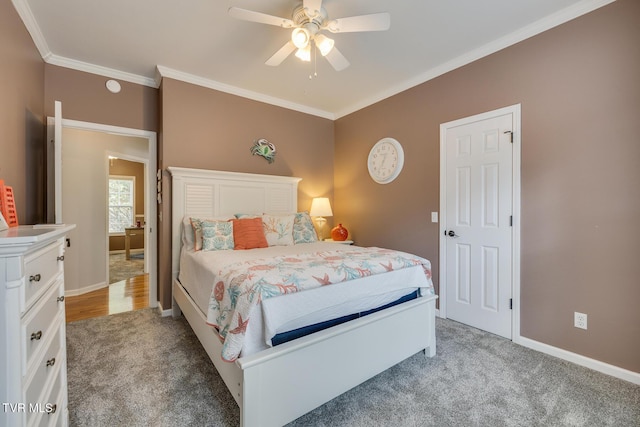 bedroom featuring ceiling fan, crown molding, and carpet floors