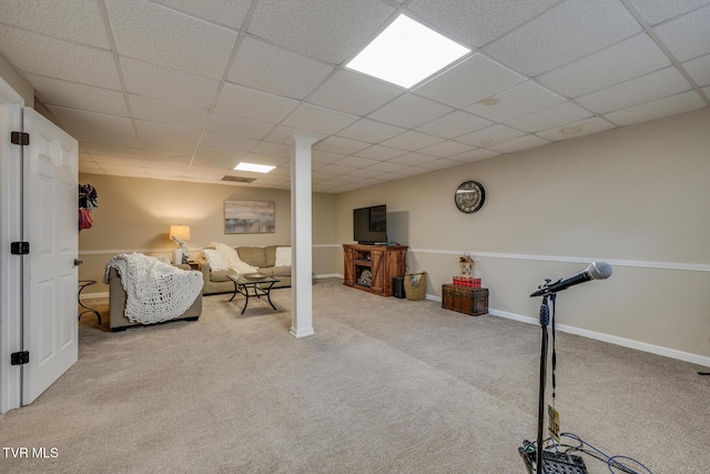 interior space featuring carpet and a drop ceiling