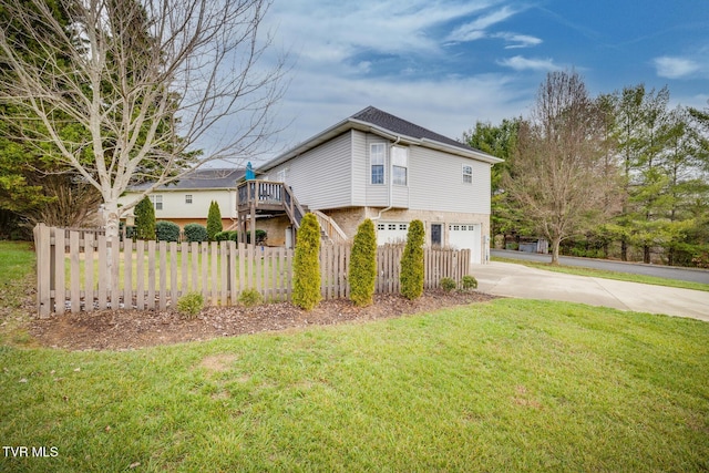 view of property exterior with a yard and a garage