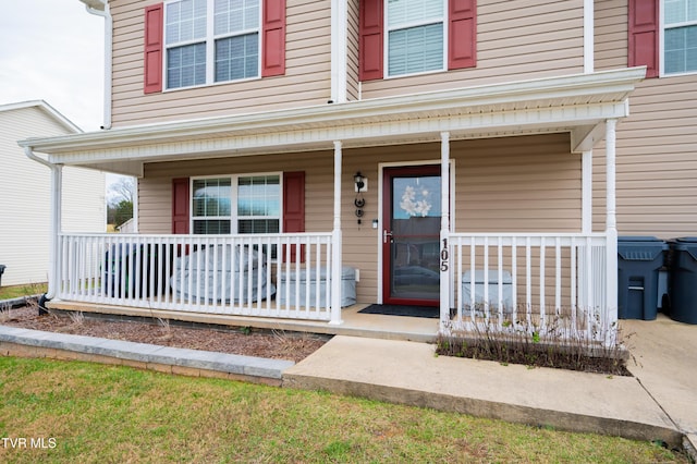 doorway to property featuring a porch