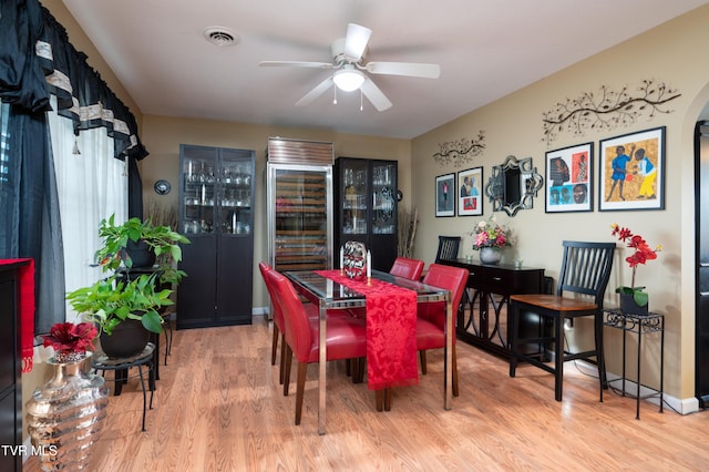 dining room featuring ceiling fan and light wood-type flooring