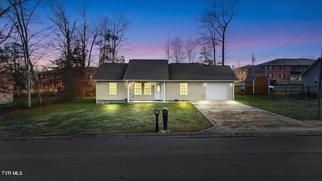 ranch-style house with a yard and a storage shed