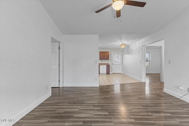 unfurnished living room featuring wood-type flooring and ceiling fan