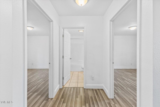 hallway featuring light hardwood / wood-style flooring