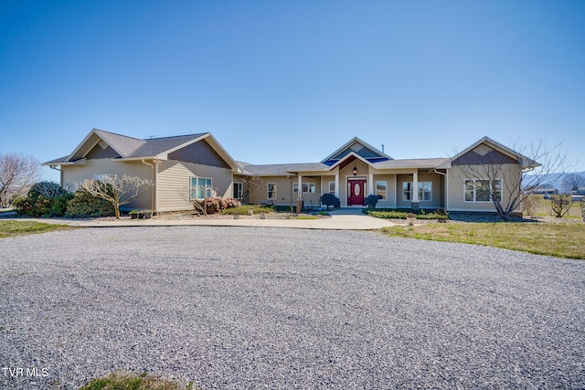 ranch-style home featuring a front lawn