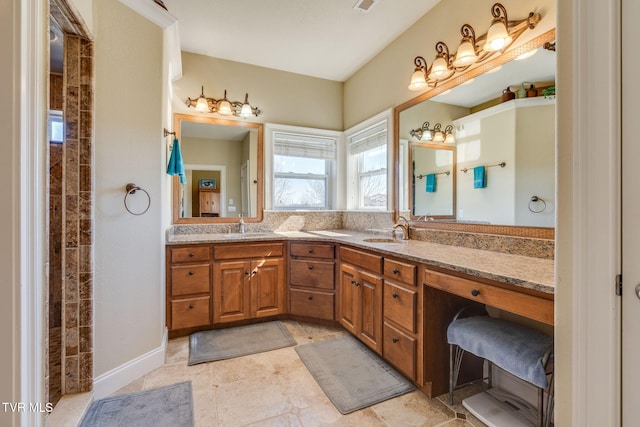 bathroom featuring double vanity and a sink