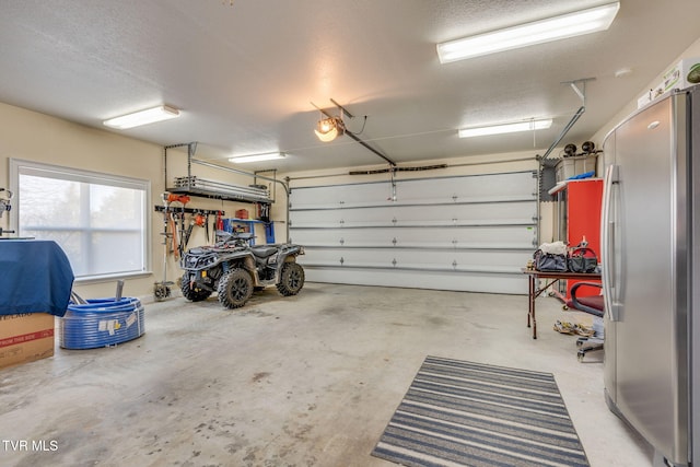 garage with freestanding refrigerator