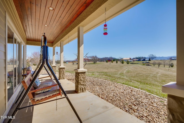 view of patio featuring a porch