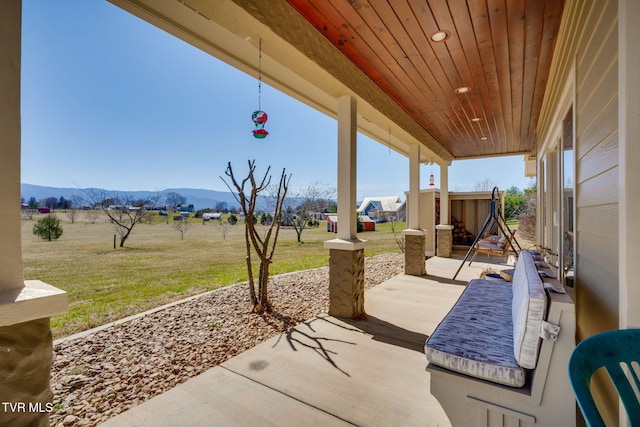 view of patio / terrace with a mountain view