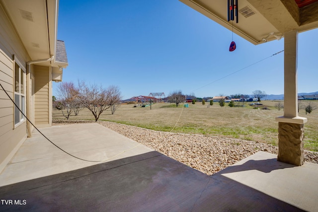 view of yard featuring visible vents and a patio