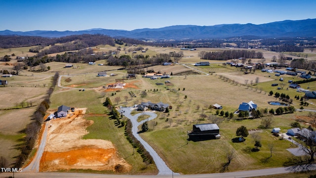 aerial view featuring a rural view and a mountain view