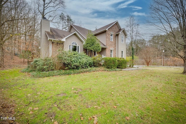 view of property exterior featuring a lawn