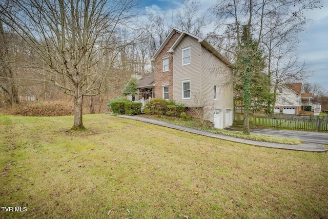 view of property exterior featuring a lawn