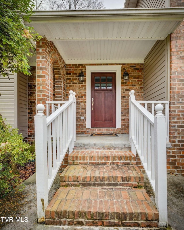 property entrance with covered porch