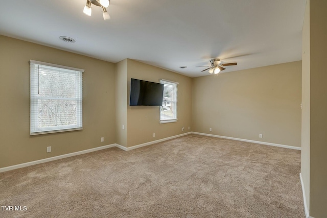 carpeted empty room with ceiling fan