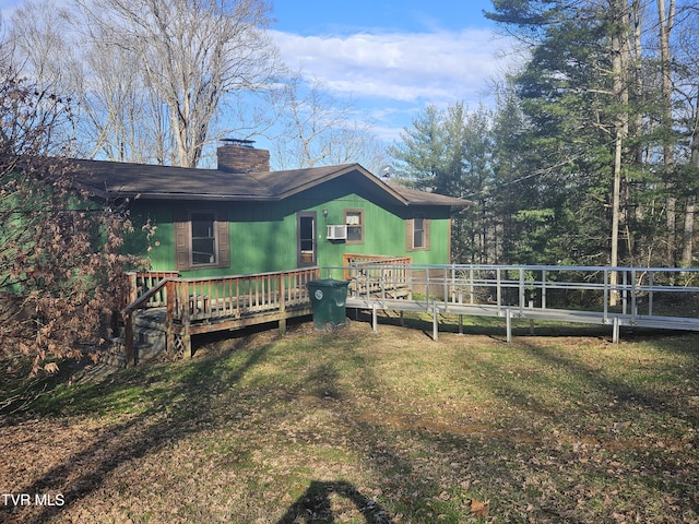 view of yard featuring a wooden deck and cooling unit