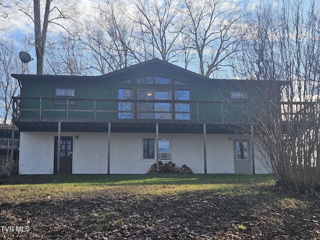 back of house featuring a wooden deck and cooling unit