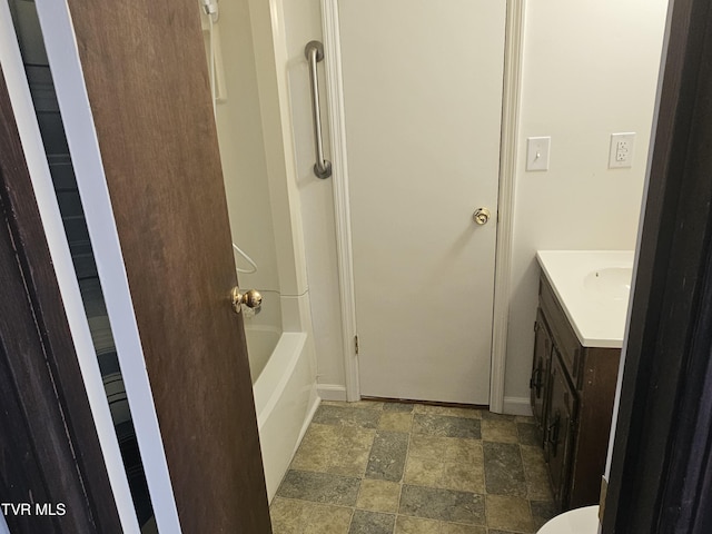 bathroom featuring bathing tub / shower combination and vanity