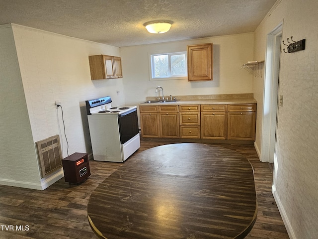 kitchen featuring dark hardwood / wood-style flooring, a textured ceiling, heating unit, white range with electric stovetop, and sink