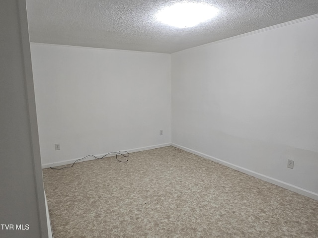 spare room with a textured ceiling