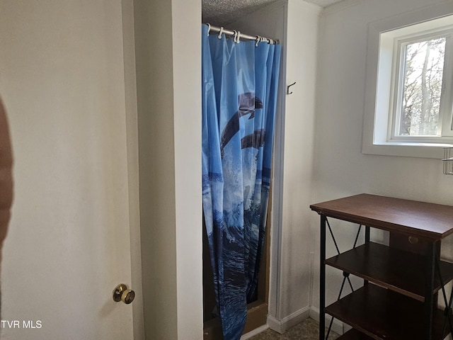 bathroom featuring curtained shower