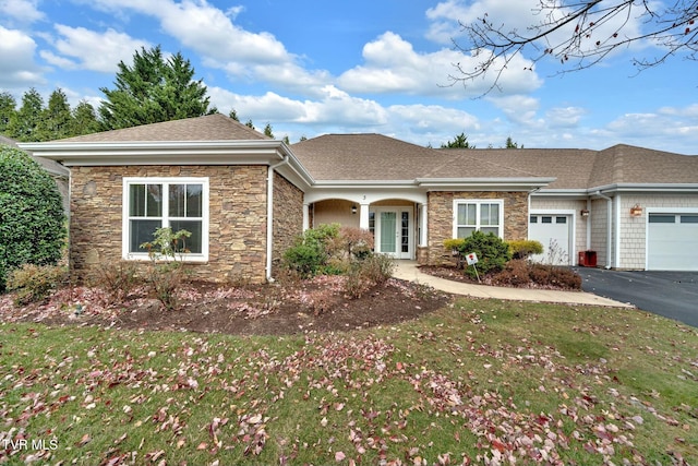 view of front facade with a garage and a front yard