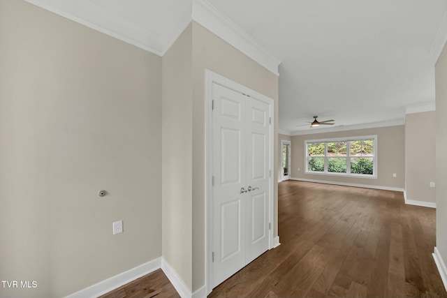 hall featuring dark hardwood / wood-style floors and ornamental molding