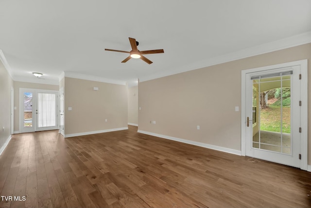 unfurnished living room featuring a wealth of natural light, ceiling fan, crown molding, and wood-type flooring