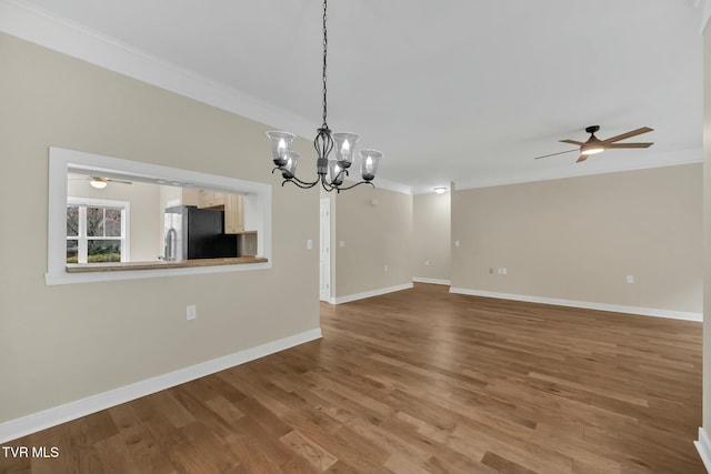 unfurnished living room with crown molding, wood-type flooring, and ceiling fan with notable chandelier