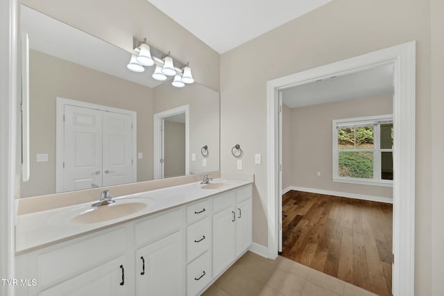 bathroom with tile patterned floors and vanity