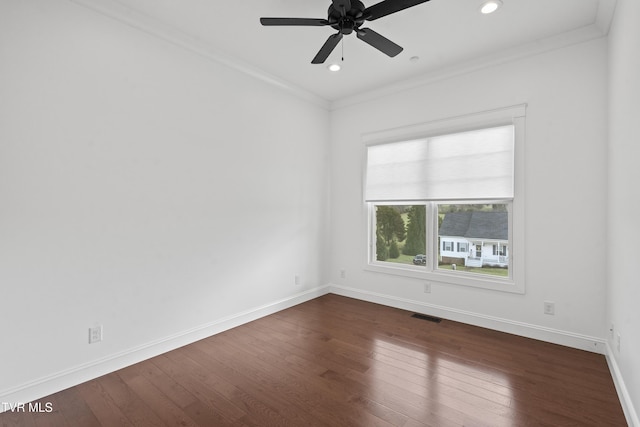 unfurnished room featuring crown molding, dark hardwood / wood-style flooring, and ceiling fan